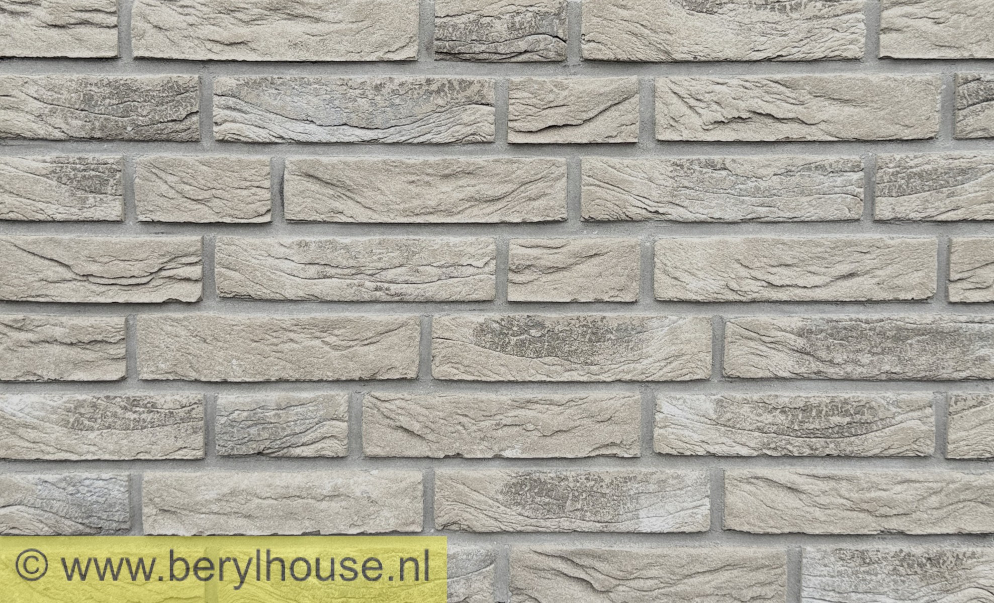 Grijze metselstenen van Beryl House.